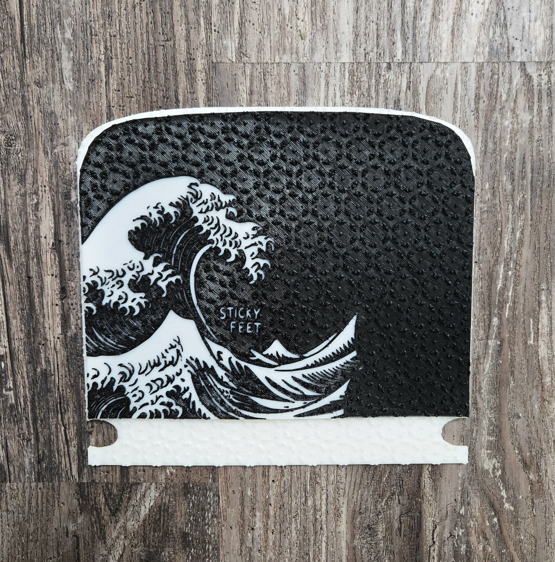 Onewheel Grip Pad on the Grip dock system, black and white wave design, Front view